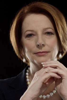 Putting pen to paper: Julia Gillard.