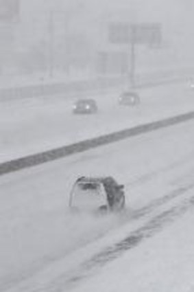 Few cars drive on Interstate 44 in St. Louis, Missouri on Sunday. Snow-covered roads and high winds were creating dangerous driving conditions from Missouri to Delaware on Sunday ahead of a "polar vortex" that'll bring below-zero temperatures not seen in decades to much of the nation in the coming days, likely setting records.