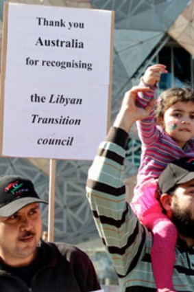 Libyan people in Melbourne take to Federation Square to celebrate the news that the Libyan government has been brought down.