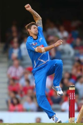 Kane Richardson bowls during the game against the Hurricanes.