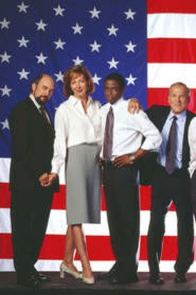 The cast of <i>West Wing</i>: (l-r) Richard Schiff as Communications Director Toby Ziegler; Allison Janney as Press Secretary CJ Gregg, Dule Hill as aide Charlie Young, John Spencer as Chief of Staff Leo McGarry, Martin Sheen as President Josiah Bartlet, Rob Lowe as Deputy Communications Director Sam Seaborn, Janel Moloney as Assistant Donna Moss, Brad Whitford as Deputy Chief of Staff Josh Lyman.