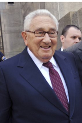 Henry Kissinger leaves the court.