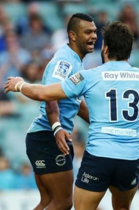 Kurtley Beale celebrates a try with Adam Ashley-Cooper on Sunday afternoon.