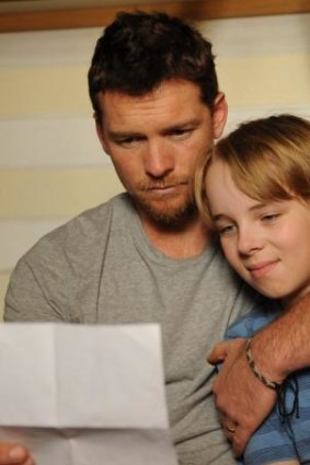 Father and son ... Ed Oxenbould and Sam Worthington in <i>Paper Planes</i>. 