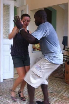 Expert instruction: Larissa Ham dances with doctor-turned-tutor Leonardo, in Havana.