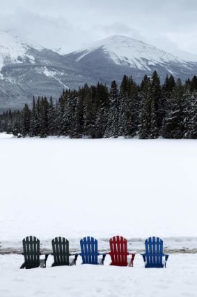 Colourful chairs at lake Beauvert in Jasper National Park.
