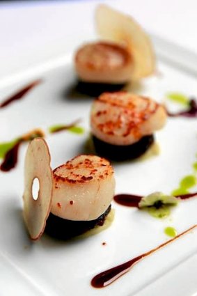Go-to dish ... seared scallops with black pudding, apple marmalade and lobster jus.