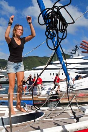 Dekker docks her yacht, Guppy, on the Caribbean island of St Martin on Saturday after ending her year-long solo voyage around the world.