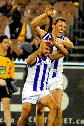 Drew Petrie celebrates with Matt Campbell after the latter kicked a goal against Richmond.