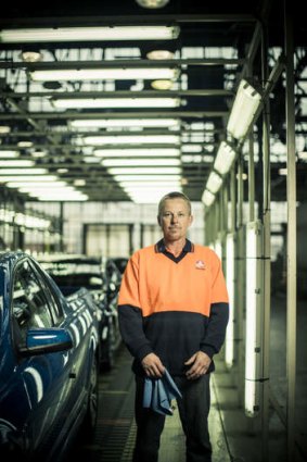 Check, mate … quality checker Tony Poole at Holden's Elizabeth plant in Adelaide's far north.