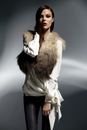 Arthur Galan Mongolian fur vest, $449; tie-side slouch blouse, $279; stretch leather pant, $698.