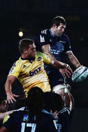 James Broadhurst of the Hurricanes competes with Tom Donnelly of the Blues in the lineout.