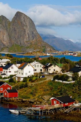 Take a trip to the Lofoten Islands and admire Norway's stunning mountains.