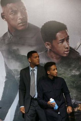 Will and Jaden Smith pose for a photo while promoting their science fiction film After Earth.