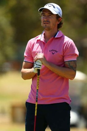 Harry Kewell watches the tee shot of a playing partner on the 11th hole during the Pro-Am Series in Perth on Thursday.