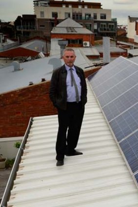 Bob Bath with panels threatened by an eight-storey development.