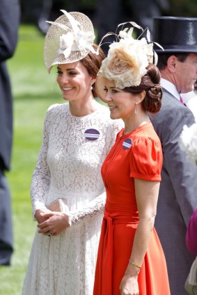 Kate opted for a white lace Dolce & Gabbana dress, while Mary wore an orange Marc Jacobs number.