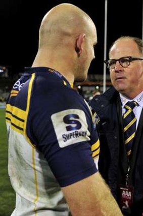 Brumbies coach Jake White congratulates Stephen Moore after winning against the Cheetahs.