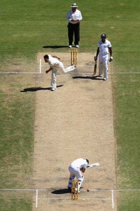 On the rise: Mitchell Johnson lets rip with a bouncer at England’s Joe Root.