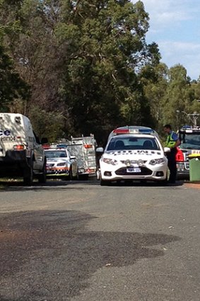 Police and fire fighters at the scene of a fatal house fire in Sawyers Valley.