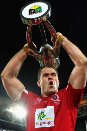 Champions of the southern hemisphere ... Reds captain James Horwill is chaired by team mates after the 2011 Super Rugby Grand Final.