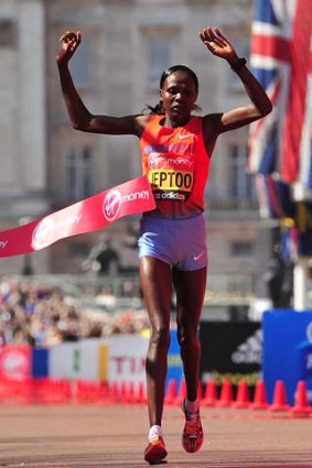Priscah Jeptoo of Kenya crosses the line to win the women's race.