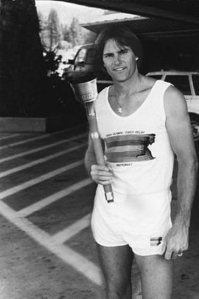 Jenner poses with the 1984 Olympic Torch.