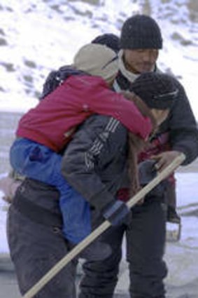 Into the wild: Families risk their lives crossing the river.
