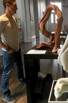 Artist Scott Selkirk with his original sculpture in wood and the 3D printed reproduction in white, at the University of Melbourne 3D showcase earlier this month.