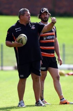 Tigers mentor: Steve Roach with Wests Tigers prop Aaron Woods at training earlier this year.