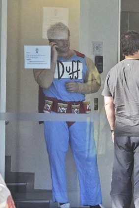 Under siege ... James Graham dressed as <i>Simpsons</i> characted Duffman at the Bulldogs' Mad Monday celebrations.
