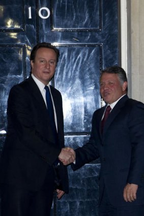 British Prime Minister David Cameron (L) with Jordan's King Abdullah outside 10 Downing Street.