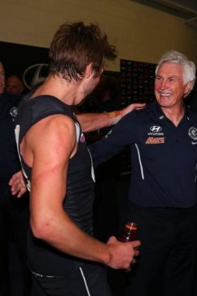 Mick Malthouse and Dale Thomas celebrate the win.