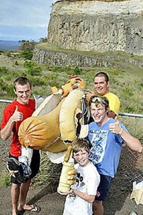 Rescuers (from left) David McVeigh, Michael Lehane, Joe Guiso and Sam Mayes lift the Sausage King out of the old quarry.