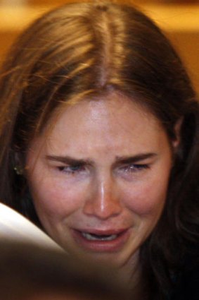 Amanda Knox cries tears of relief at her murder conviction being overturned.