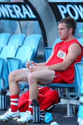 Ben McGlynn on the bench after sustaining an injury.