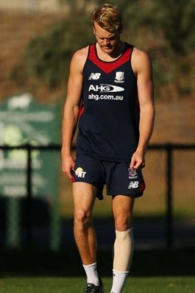 Jack Watts wears a compression bandage during a training session.