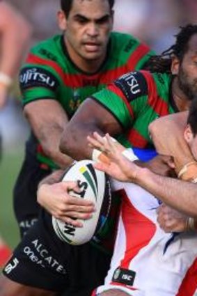 Tough going: Jake Mamo is wrapped up by the Souths defence. 