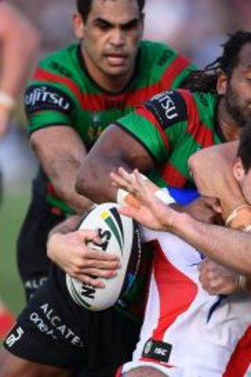 Tough going: Jake Mamo is wrapped up by the Souths defence. 