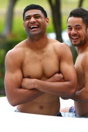 Daniel Tupou (left) and Jarryd Hayne grin and bare it in an ice bath after Blues training.