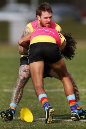 Dane Swan  tackles Tony Armstrong during a training session last week.