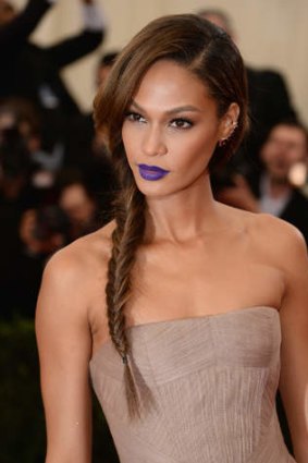 Purple reigns: model Joan Smalls attends a function at New York's Metropolitan Museum of Art in May.