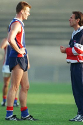 Luke Darcy and Terry Wallace exchange ideas back in 1998.