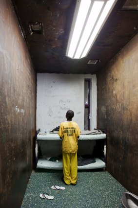 A 12-year-old juvenile in his windowless cell at Harrison County Juvenile Detention Center in Biloxi, Mississippi. The prison is run by Mississippi Security Police, a private service.  