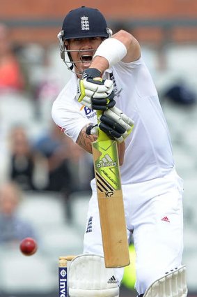 Ton up: Kevin Pietersen celebrates his century in the first innings of the third at Test at Old Trafford.