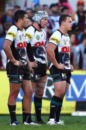 Crushing loss: Bemused Panthers players after the final-minute loss to Manly