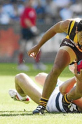 Cyril Rioli breaks a tackle in the 2008 grand final.