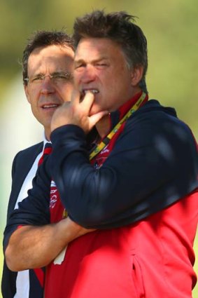 Faces in the crowd: Former Melbourne CEO Cameron Schwab with Todd Viney at Melbourne's training session on Friday.