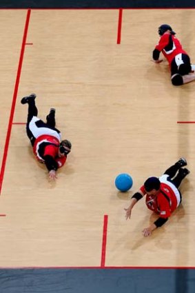 Jen Armbruster (top), Lisa Czechowski (centre) and Asya Miller of the US during a women's goalball match against Sweden.