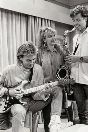 Singing is only a good start ... Kylie Minogue, Jason Donovan and Guy Pearce on the set of Neighbours.